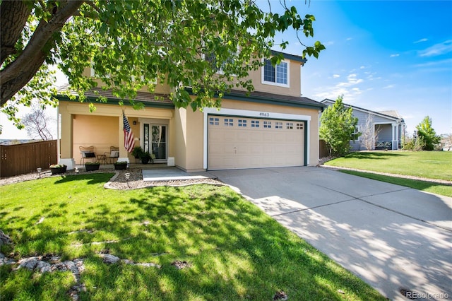 4963 Collingswood Dr, Highlands Ranch, CO 80130 - view of front of property with concrete driveway, stucco siding, a garage, and a porch