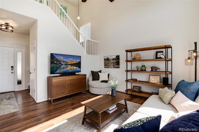 4963 Collingswood Dr, Highlands Ranch, CO 80130 - living room with wood finished floors, a towering ceiling, baseboards, stairway, and ceiling fan
