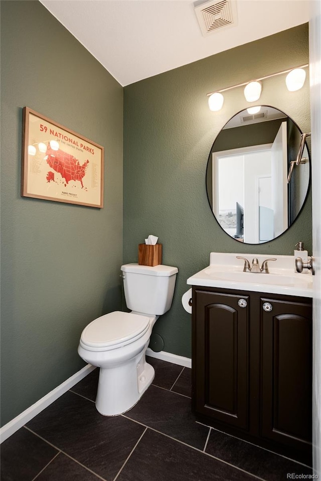 4963 Collingswood Dr, Highlands Ranch, CO 80130 - half bath with tile patterned floors, toilet, vanity, and baseboards