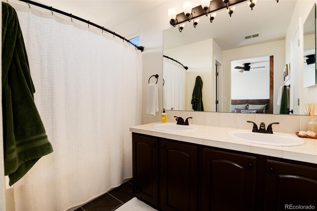 4963 Collingswood Dr, Highlands Ranch, CO 80130 - full bathroom with double vanity, tile patterned flooring, and a ceiling fan