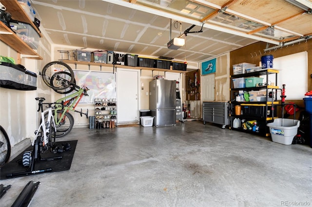 4963 Collingswood Dr, Highlands Ranch, CO 80130 - garage with freestanding refrigerator and a garage door opener