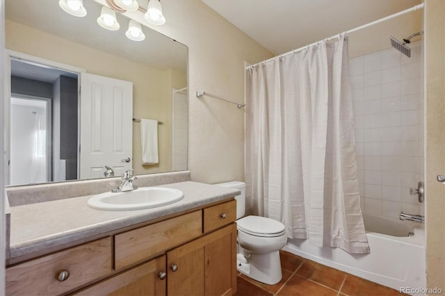 bathroom with toilet, shower / tub combo, tile patterned flooring, vanity, and a textured wall