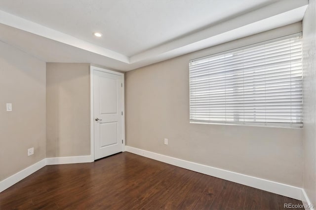 unfurnished room with recessed lighting, baseboards, and wood finished floors