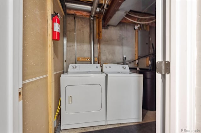 clothes washing area with laundry area and washer and clothes dryer