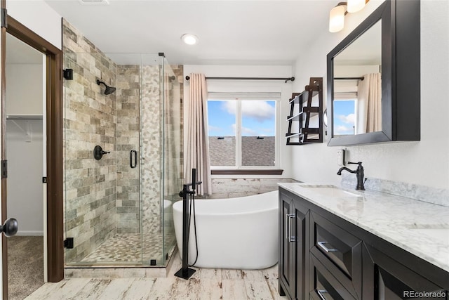 2430 S Halifax Way, Aurora, CO 80013 - bathroom featuring a stall shower, a soaking tub, and double vanity