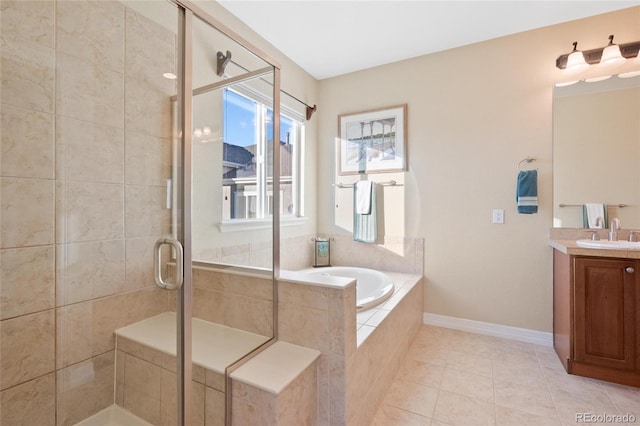 bathroom featuring vanity, tile patterned flooring, and independent shower and bath