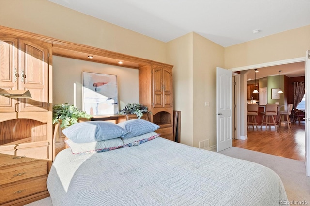 bedroom featuring light carpet