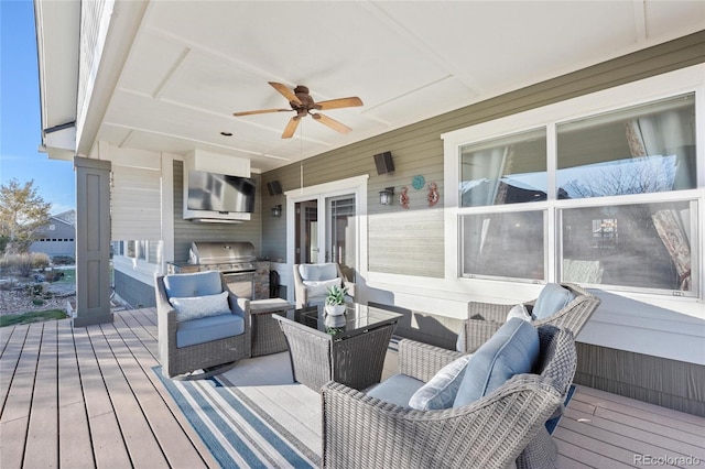 deck with ceiling fan and a grill