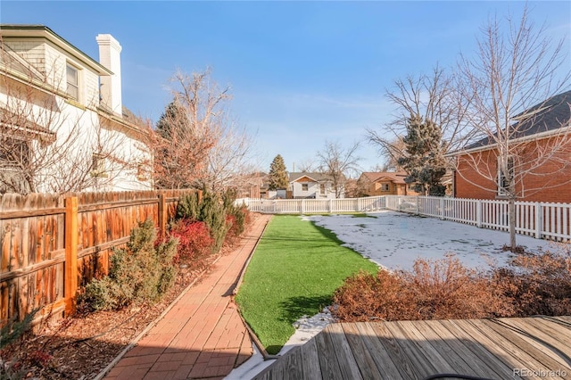 view of yard with a wooden deck