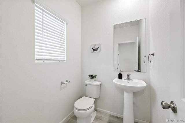 9723 Borderpine Way, Colorado Springs, CO 80925 - bathroom featuring toilet and baseboards