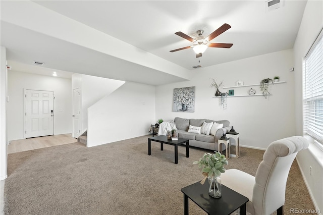 9723 Borderpine Way, Colorado Springs, CO 80925 - carpeted living area featuring stairway and a ceiling fan