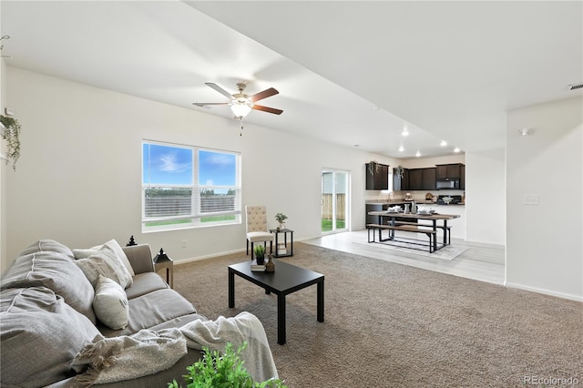 9723 Borderpine Way, Colorado Springs, CO 80925 - living area featuring light carpet, a ceiling fan, and recessed lighting