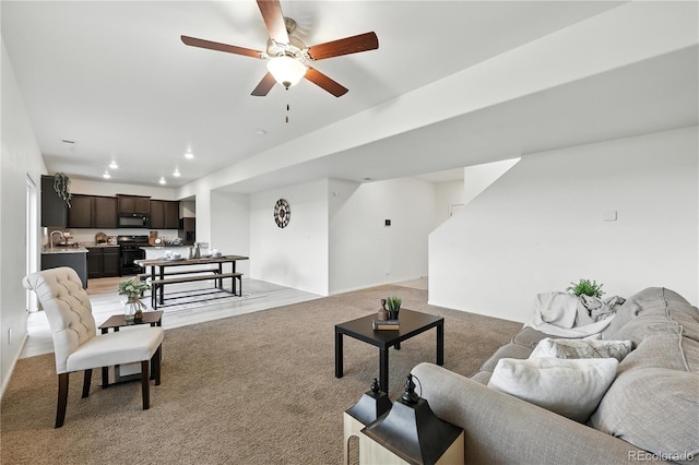 9723 Borderpine Way, Colorado Springs, CO 80925 - living area with light colored carpet, ceiling fan, and recessed lighting