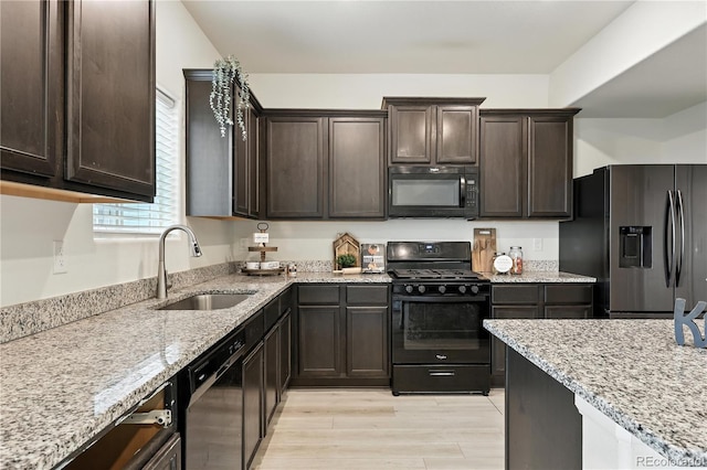 9723 Borderpine Way, Colorado Springs, CO 80925 - kitchen featuring black appliances, dark brown cabinetry, and light stone countertops