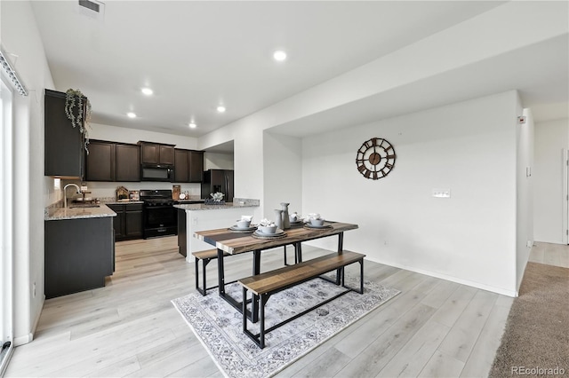9723 Borderpine Way, Colorado Springs, CO 80925 - dining area with light wood-style flooring and recessed lighting