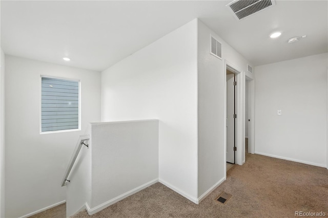 9723 Borderpine Way, Colorado Springs, CO 80925 - hallway with an upstairs landing, light colored carpet, and recessed lighting