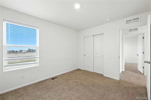 9723 Borderpine Way, Colorado Springs, CO 80925 - unfurnished bedroom featuring light carpet and a closet