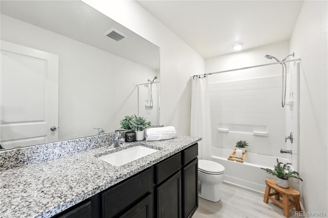 9723 Borderpine Way, Colorado Springs, CO 80925 - full bathroom featuring vanity, shower / bath combo with shower curtain, and wood finished floors