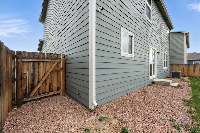 9723 Borderpine Way, Colorado Springs, CO 80925 - view of property exterior with a cooling unit and a gate