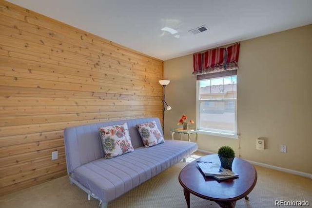 10451 Truckee St Unit 2D, Commerce City, CO 80022 - living area featuring wooden walls, carpet flooring, and baseboards