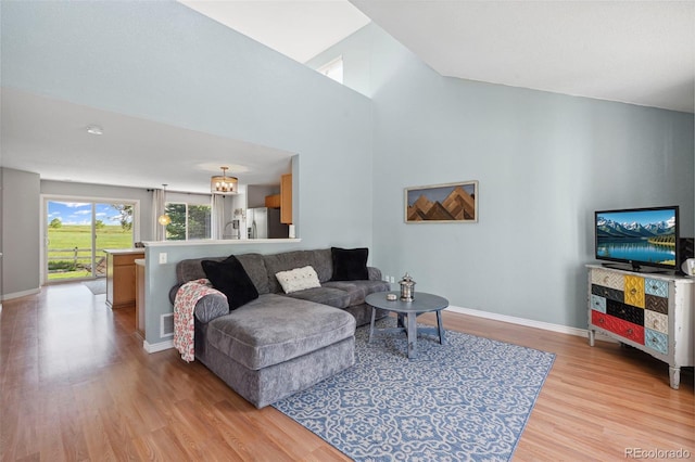 7977 Emerson Ave, Frederick, CO 80530 - living area featuring light wood-style floors and a high ceiling