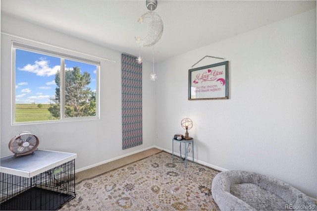 7977 Emerson Ave, Frederick, CO 80530 - living area with carpet flooring and baseboards