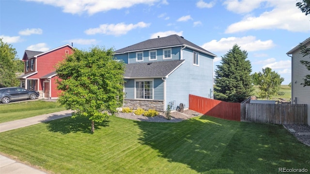 7977 Emerson Ave, Frederick, CO 80530 - view of front of home with stone siding and a shingled roof