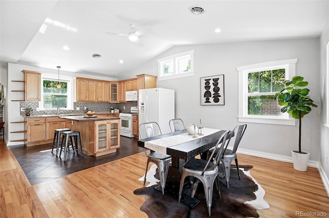 3321 Stuart St, Denver, CO 80212 - dining room with healthy amount of natural light, ceiling fan, vaulted ceiling, dark wood finished floors, and recessed lighting