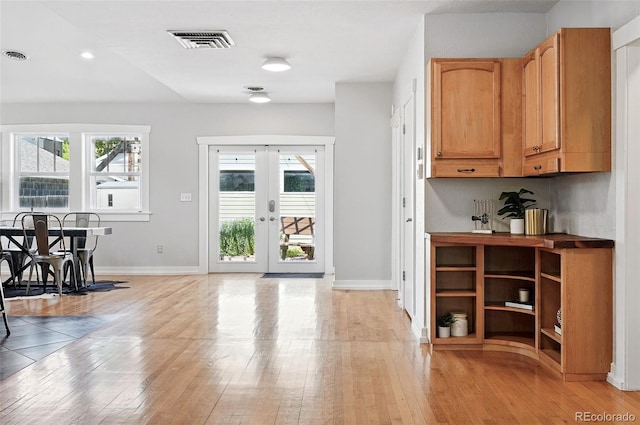3321 Stuart St, Denver, CO 80212 - entryway featuring light wood finished floors, french doors, baseboards, and recessed lighting