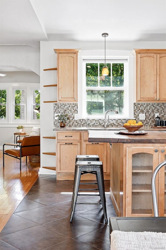 3321 Stuart St, Denver, CO 80212 - kitchen featuring light brown cabinets, tasteful backsplash, a sink, open shelves, and pendant lighting
