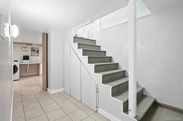 3321 Stuart St, Denver, CO 80212 - staircase featuring washer / clothes dryer, tile patterned flooring, and baseboards