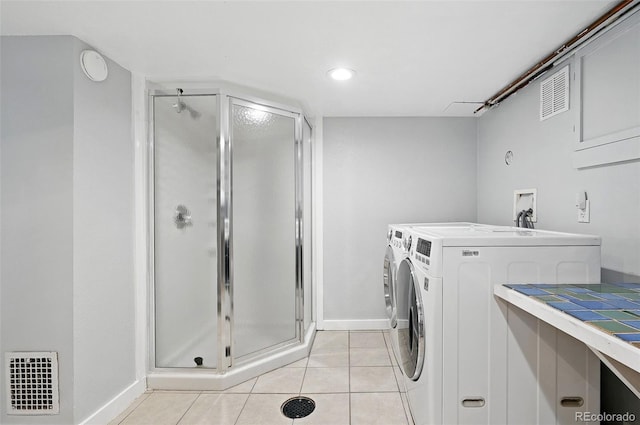 3321 Stuart St, Denver, CO 80212 - laundry room featuring washer and dryer, baseboards, light tile patterned floors, and recessed lighting