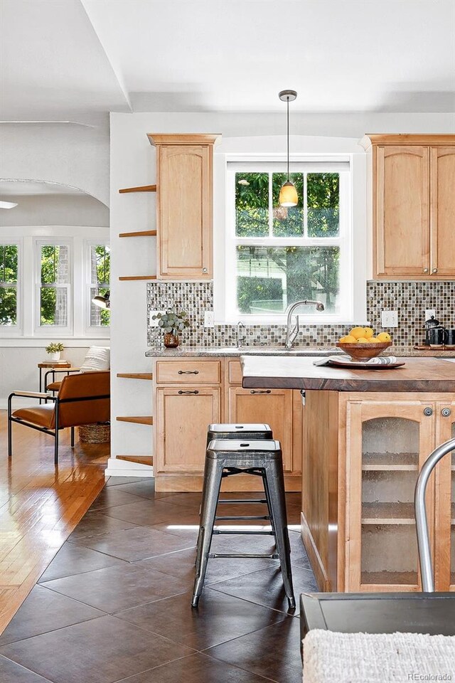 3321 Stuart St, Denver, CO 80212 - kitchen with light brown cabinets, tasteful backsplash, a sink, open shelves, and pendant lighting