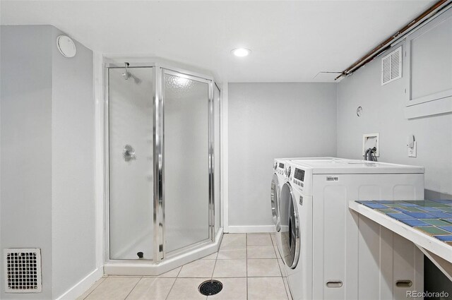 3321 Stuart St, Denver, CO 80212 - washroom featuring washer and clothes dryer, baseboards, light tile patterned floors, and recessed lighting