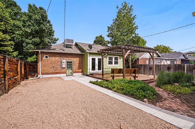 3321 Stuart St, Denver, CO 80212 - rear view of house featuring french doors, a pergola, a fenced backyard, brick siding, and a patio