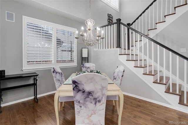 15372 E 117th Ave, Commerce City, CO 80022 - dining area with stairs, wood finished floors, a chandelier, and plenty of natural light