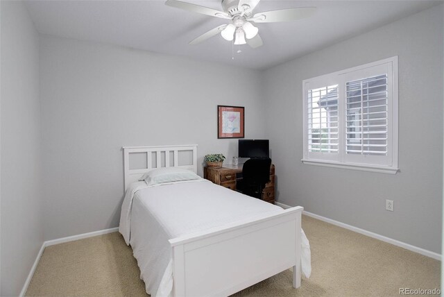 15372 E 117th Ave, Commerce City, CO 80022 - bedroom featuring light carpet, baseboards, and ceiling fan