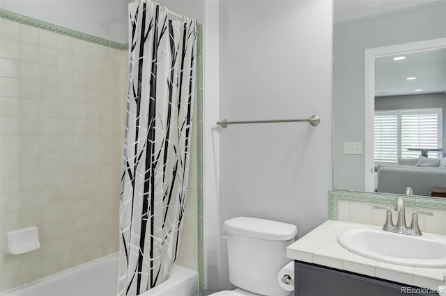 15372 E 117th Ave, Commerce City, CO 80022 - bathroom featuring shower / tub combo, vanity, toilet, and ensuite bathroom