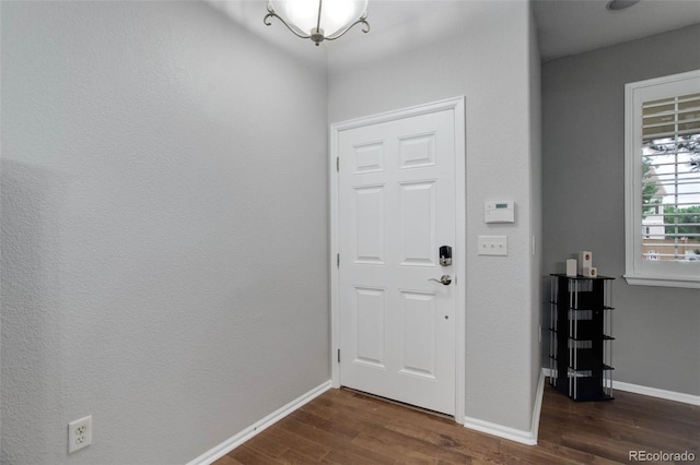 15372 E 117th Ave, Commerce City, CO 80022 - entryway featuring dark wood-style flooring and baseboards