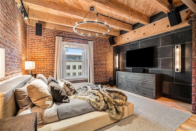 bedroom with hardwood / wood-style flooring, wood ceiling, brick wall, and beam ceiling