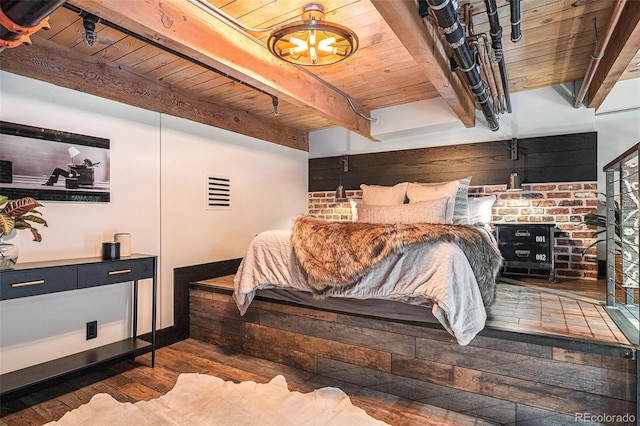 bedroom featuring beamed ceiling, dark wood-type flooring, and wood ceiling