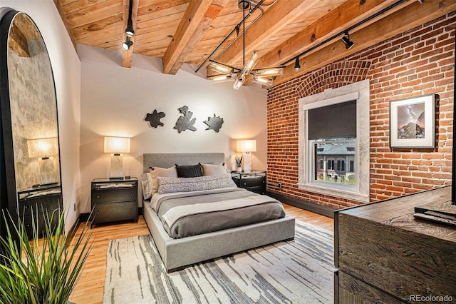 bedroom with brick wall, track lighting, wooden ceiling, and light hardwood / wood-style flooring