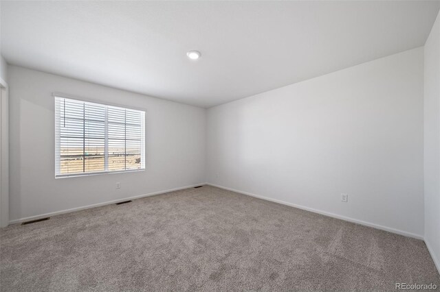 3869 N Shawnee St, Aurora, CO 80019 - carpeted empty room featuring baseboards