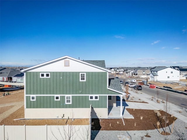 3869 N Shawnee St, Aurora, CO 80019 - view of side of property featuring a residential view and board and batten siding