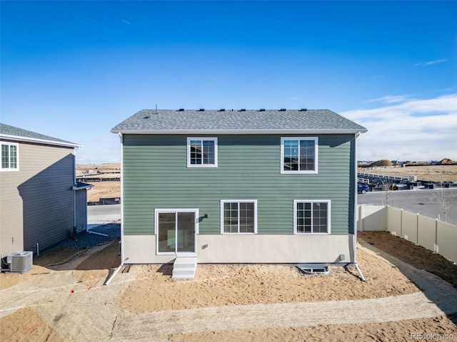 3869 N Shawnee St, Aurora, CO 80019 - back of house featuring central air condition unit