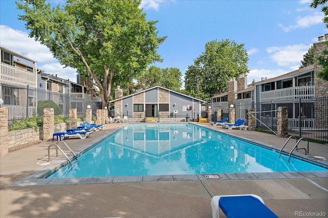 8335 Fairmount Dr Unit 2-105, Denver, CO 80247 - community pool featuring a patio area and a residential view