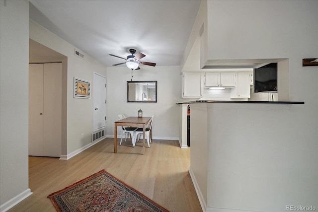 8335 Fairmount Dr Unit 2-105, Denver, CO 80247 - hall featuring light wood-style floors and baseboards