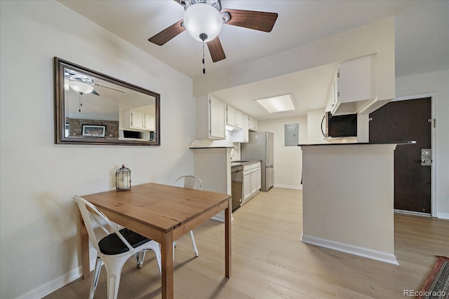 8335 Fairmount Dr Unit 2-105, Denver, CO 80247 - dining space with a ceiling fan, baseboards, light wood-type flooring, and electric panel