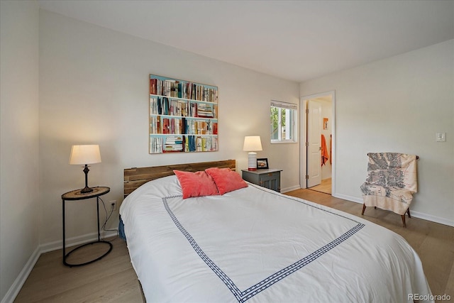 8335 Fairmount Dr Unit 2-105, Denver, CO 80247 - bedroom featuring light wood-style floors and baseboards