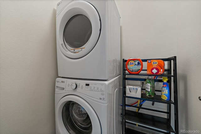 8335 Fairmount Dr Unit 2-105, Denver, CO 80247 - laundry room with stacked washer and clothes dryer